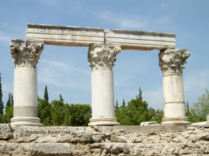 Standing on stubs of their former columns, three Corinthian capitals bear part of the entablature of the Roman temple that is known simply as E, in Ancient Corinth Â©FEG by Aristotle Koskinas